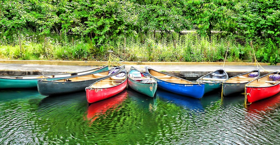 different colors of small boats